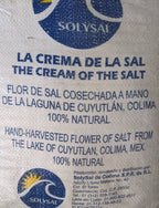 Fleur De Sel salt bag labeled 'La Crema de la Sal' from Cuyutlán, Colima, Mexico, featuring 100% natural hand-harvested sea salt.