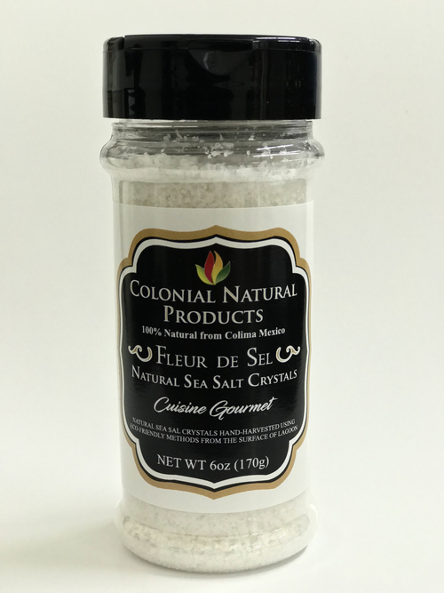Fleur De Sel Salt by Colonial Natural Products in a 6oz bottle, featuring natural sea salt crystals from Colima, Mexico for gourmet cooking.